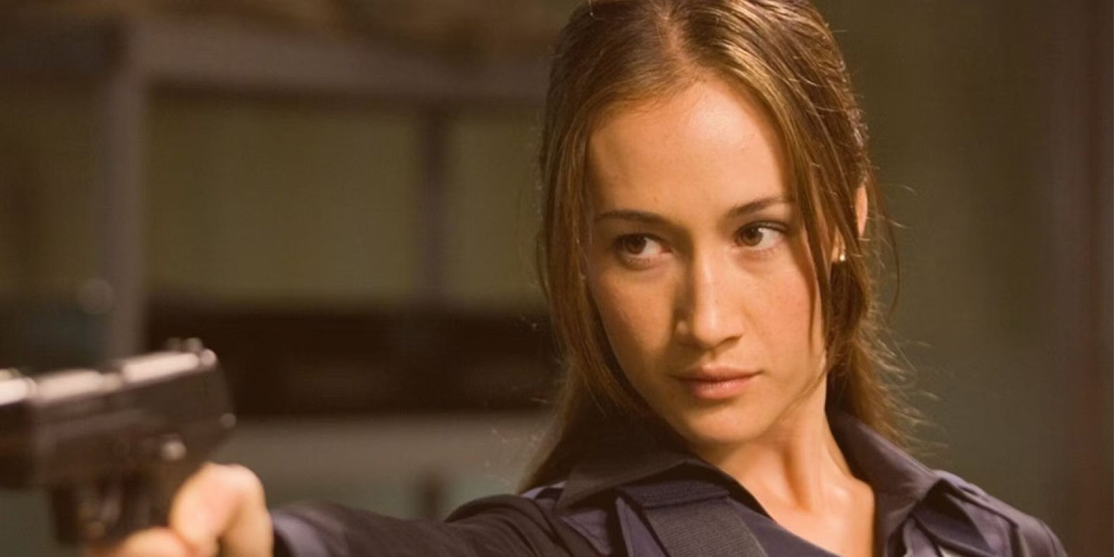 Maggie Q as Mai in Die Hard 4.0 holding a gun